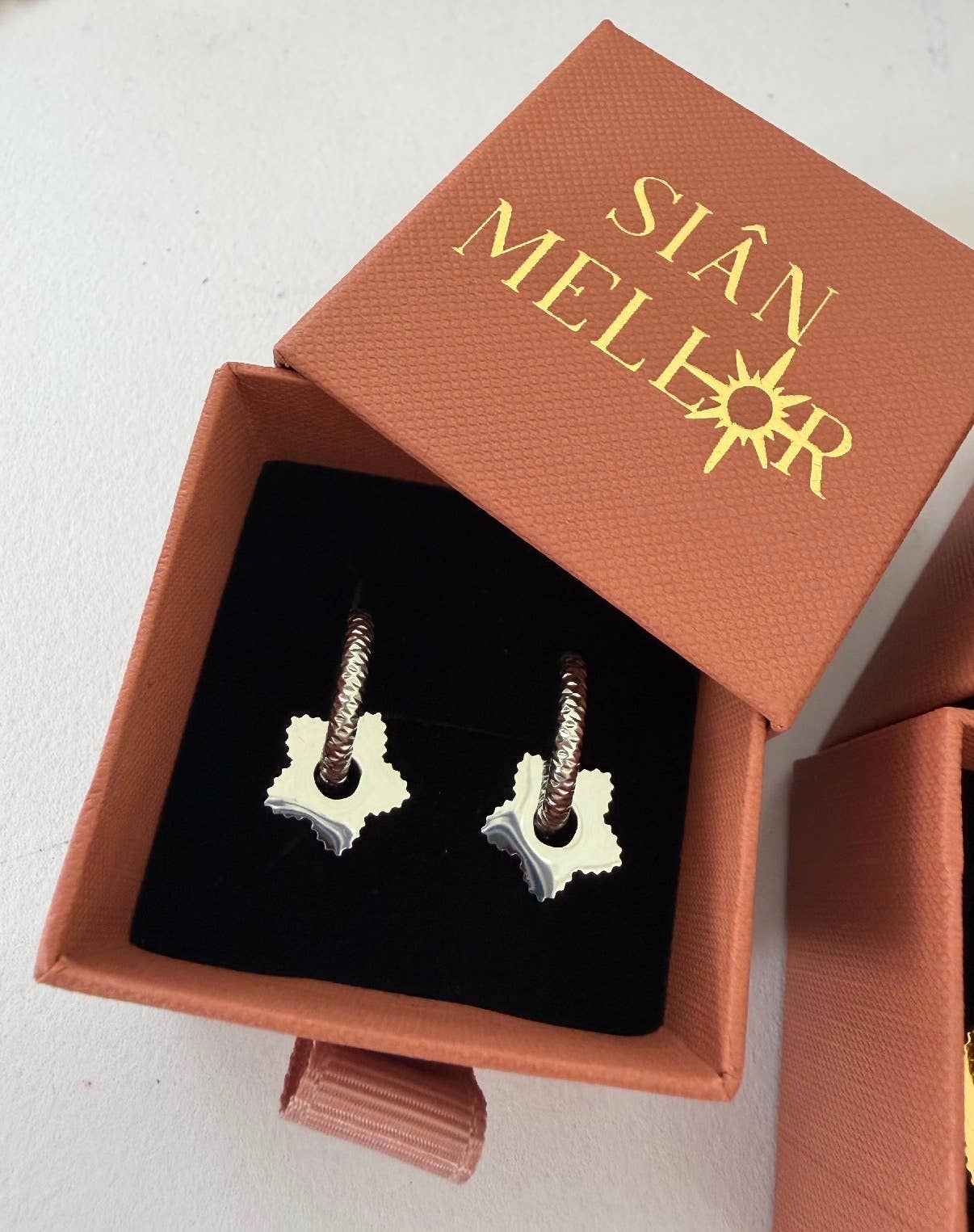 Textured star hoop earrings : Silver