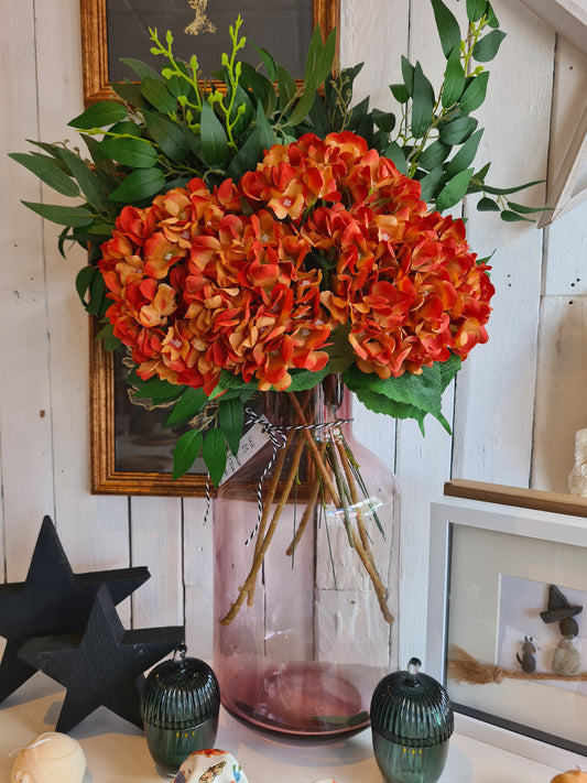Vase With Flowers and Greenery